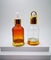 2023 nuevas botellas de cristal adaptables del dropper del diseño 30ml con el soporte inferior para el aceite esencial y los cosméticos